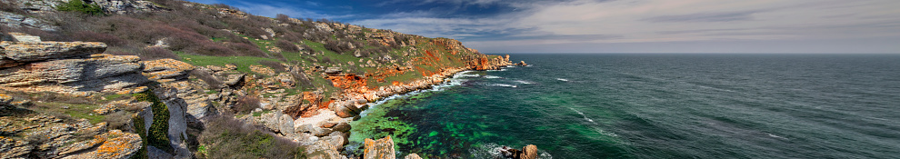 Beautiful landscape with blue sea and rocky shore - panoramic view