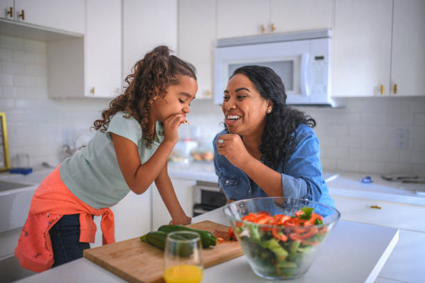 istock Mother and daughter cooking in the kitchen 1126979096