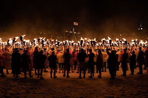 The burning of the galley about to happen during the 2019 Up Helly Aa viking fire festival procession in Lerwick in the Shetland Isles, North of Scotland UK.  Vikings and Guizers prepare to throw in their hundreds of torches into the galley ship.