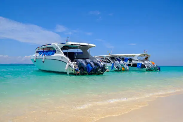 Speedboats at the beautiful beach of tropical island, in waiting for passengers.