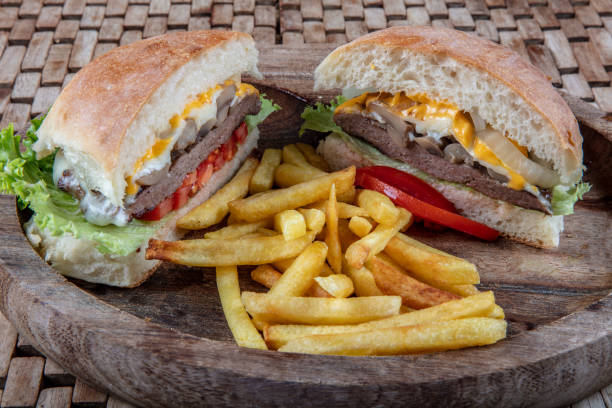 istock Delicious fresh homemade burger on a wooden table 1127001088