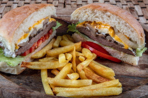 istock Delicious fresh homemade burger on a wooden table 1127001659