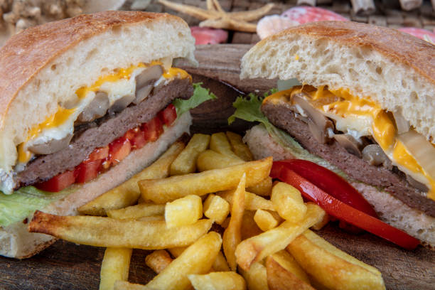 istock Delicious fresh homemade burger on a wooden table 1127002602