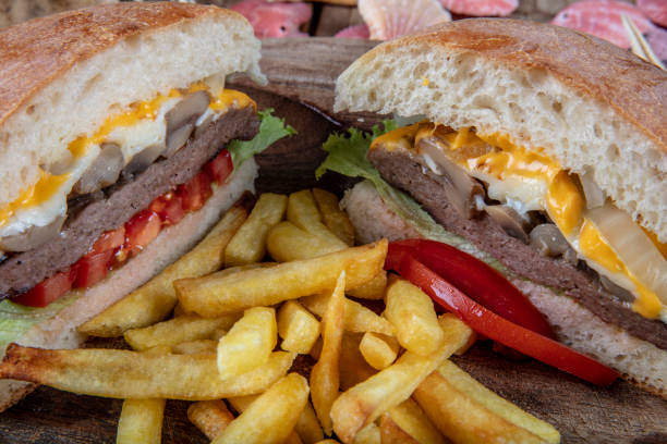 istock Delicious fresh homemade burger on a wooden table 1127002846