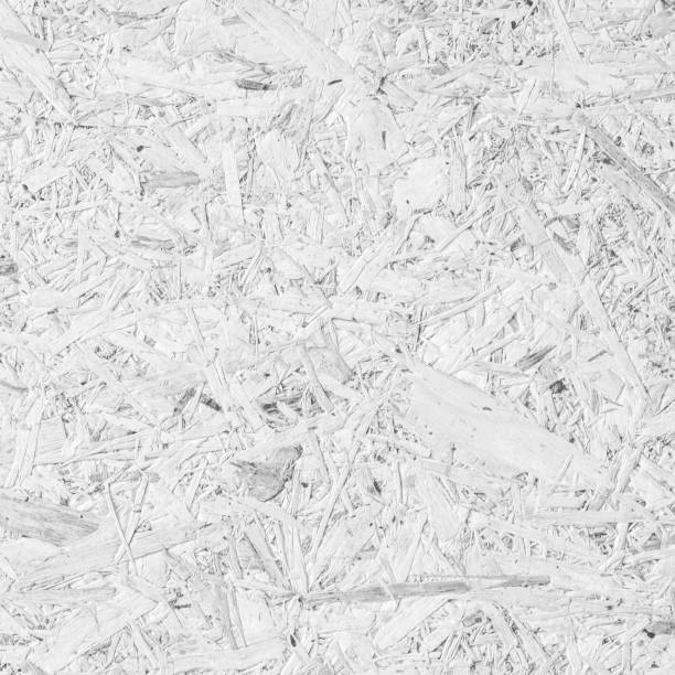 istock Chipboard, OSB -Oriented strand board particle pressed recycled wood panel background with grainy wooden fiber pattern backdrop in natural white grey color 1127009270