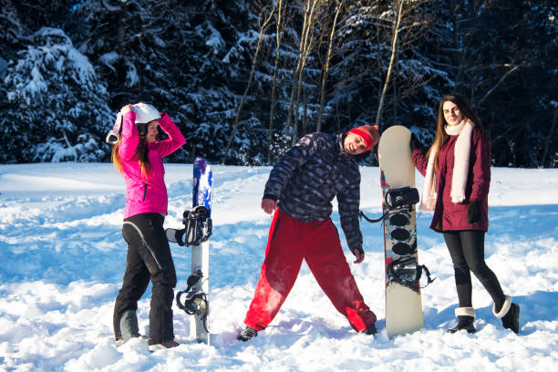 istock Happy young people on a winter vacation in the mountains. 1127010630