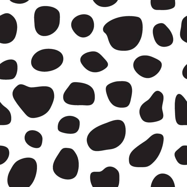 Spotty seamless pattern Spotty black and white seamless pattern. Cow's skin or dalmatian dog's skin pattern. Spots. Vector illustration. dalmatian stock illustrations