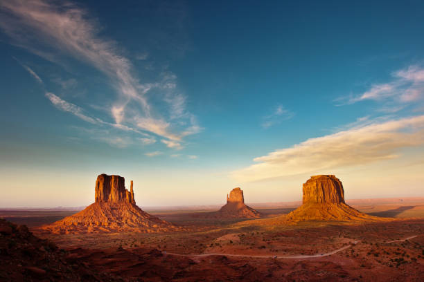 Monument Valley Tribal Park Landscape at Sunset The landscape scenery at the Monument Valley Tribal Park in Arizona, USA. A famous tourist destination in the southwest USA. The iconic western landscape is a backdrop for many western movies. monument valley photos stock pictures, royalty-free photos & images