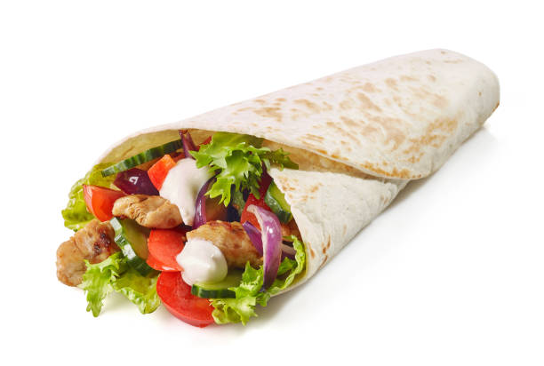 istock Tortilla wrap with fried chicken meat and vegetables 1127015539