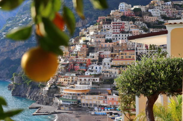 A Lemon in Positano View of the beautiful cliffside structures of Positano in Amalfi Coast, Italy. amalfi photos stock pictures, royalty-free photos & images
