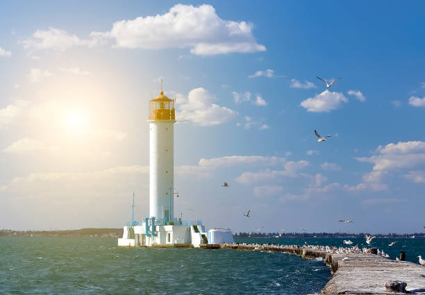 Spring sunset  Lighthouse Spring sunset  Lighthouse in Odessa harbor Ukraine odessa ukraine photos stock pictures, royalty-free photos & images