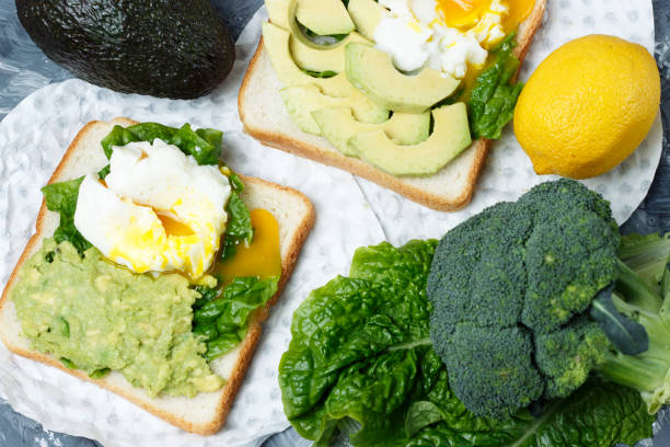 istock Sandwich with avocado and egg close-up, white and gray background 1127022903