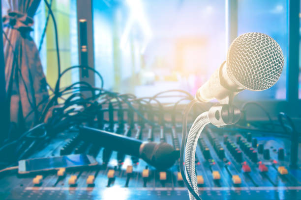 istock Double Exposure Microphones and Mixers in Record Studio. 1127026999