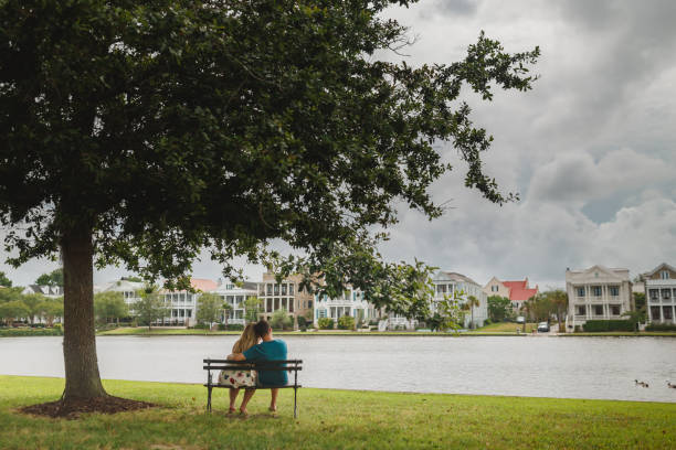 istock Couple sitting on the bench 1127031105