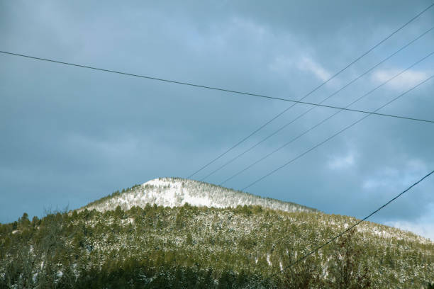 istock Wooded, Snowy Mountain in the Sun 1127036455