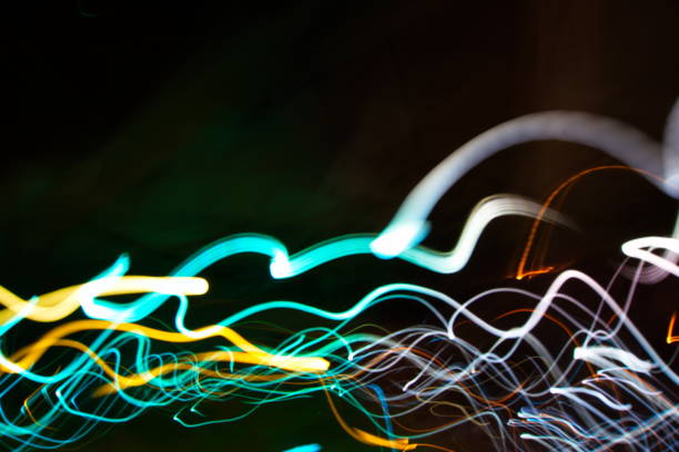 istock Abstract light painting photography, curves and waves abstract light against a black background 1127037607