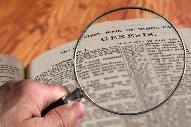 istock Magnifying Glass on Famous Bible Chapter Genesis 1127039138