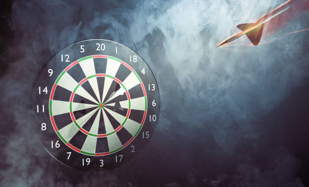istock Darts flies towards the dart board 1127043468