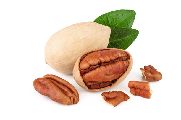 istock pecan nut with green leaves isolated on white background 1127046497