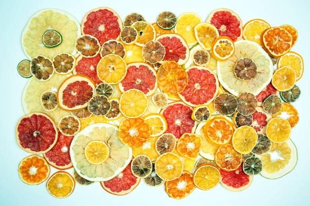 istock mix of different pieces of dried citrus fruit on white background 1127049818