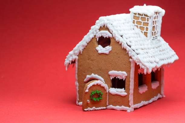 istock Cookie house on red background decorating 1127051770