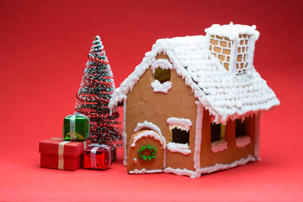 istock Cookie house christmas tree on red background 1127051786