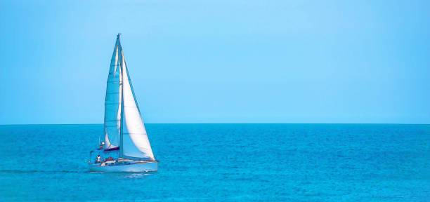 istock sailing boat flowing on the open sea, watercolor painted 1127052957
