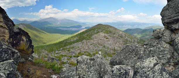 Stitched Panorama. Neighborhood of the village of Ust-Nera. Oymyakon. Yakutia. Sarychev`s ridge Khrebet Sarycheva or Tas-Kystabyt stock photo