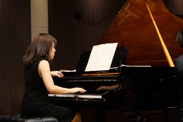 istock Pianist palying music at small room 1127053885