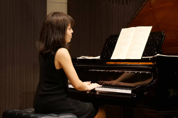 istock Pianist palying music at small room 1127053908