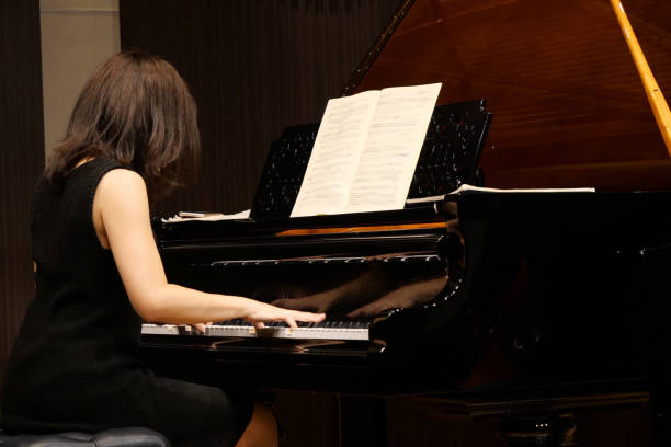 istock Pianist palying music at small room 1127053925