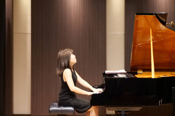 istock Pianist palying music at small room 1127053933