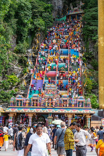 Kuala Lumpur, Malaysia. January 21, 2019. A crowd of worshipers climbs the long staircase leading to the temples during the annual Thaipusam religious festival in the Hindu temples of Batu Caves.