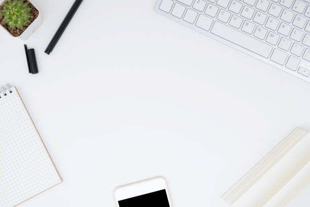 istock White office desk table with a lot of things on it. Top view with copy space, flat lay. 1127055226