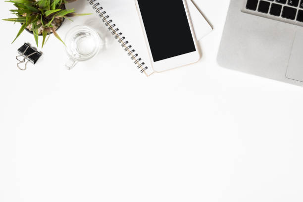 istock White office desk table with a lot of things on it. Top view with copy space, flat lay. 1127055238