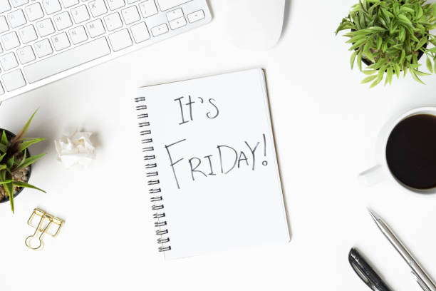 istock The notebook with Friday motivation text is on top of white office desk table. Top view, flat lay. 1127055246