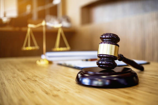 istock image of justice hammer in law firm office. 1127055456