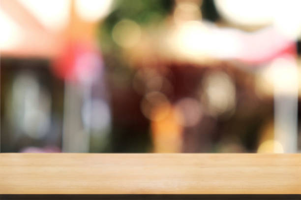 istock blank wood table with  blurred party outdoor background. 1127055478