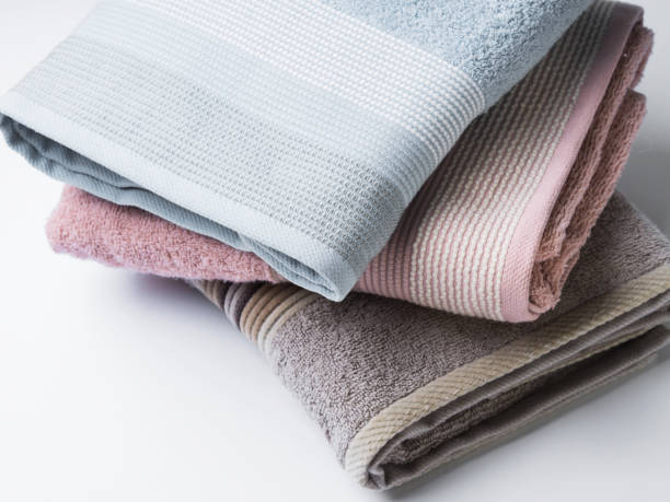 istock Pastel color clean folded towels on white 1127056589
