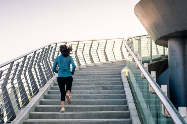 istock Female running on the stairs during a workout 1127056624