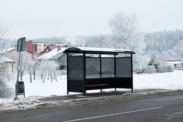 Bus stop in winter Empty bus stop in cold snowy winter day with frost on trees. stopover stock pictures, royalty-free photos & images