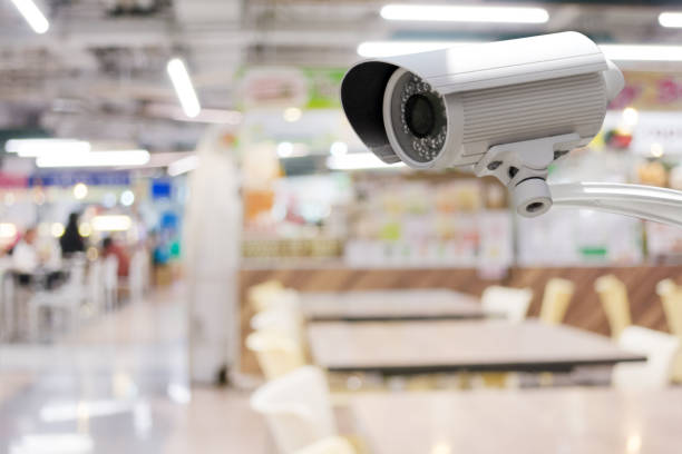 istock CCTV security camera with abstract blurred food court background 1127057692