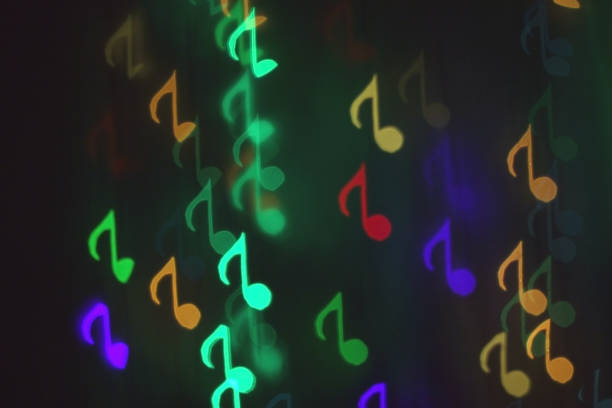 istock colorful bokeh on a dark background in the form of musical notes 1127058204