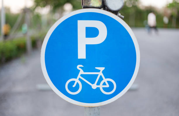 istock Bicycle sign, plate for bikes park in evening 1127059087