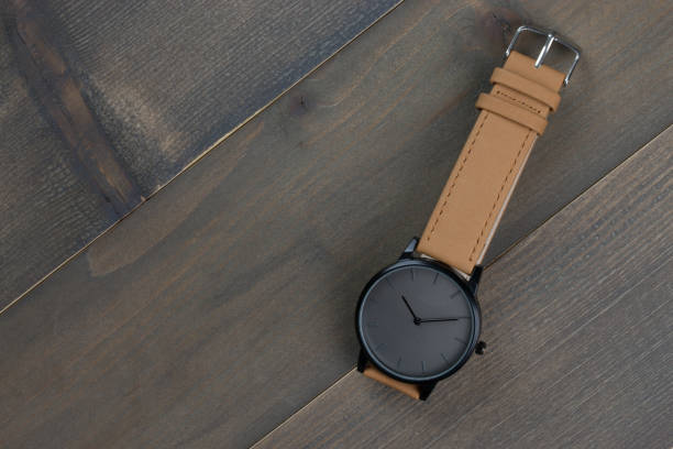 istock wristwatch on wood background with free text space 1127059340