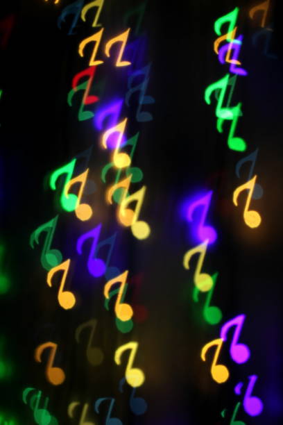 istock colorful bokeh on a dark background in the form of musical notes 1127060132