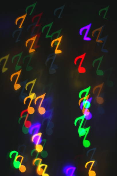 istock colorful bokeh on a dark background in the form of musical notes 1127060168