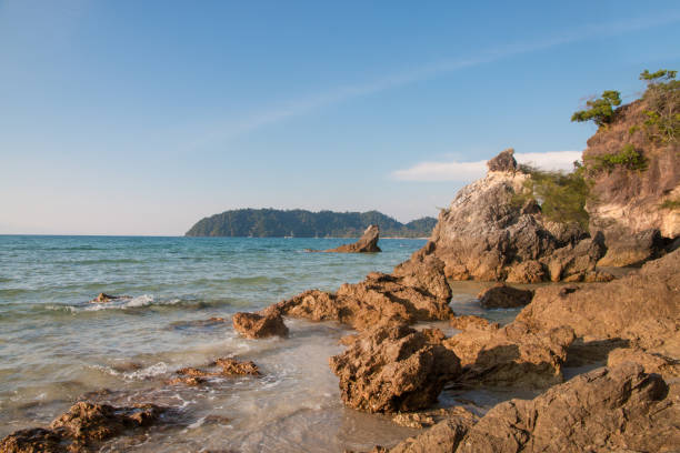 istock beautiful scene, tropical sea and beach with blue sky background 1127060230