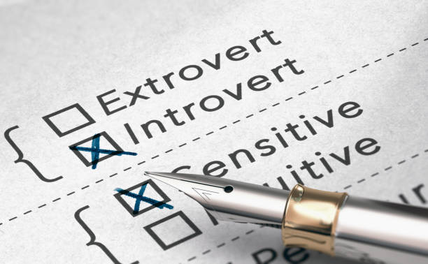 Personality Test, Extrovert or Introvert Person 3D illustration of personality test with two words extrovert and introvert and a fountain pen. personality test stock pictures, royalty-free photos & images