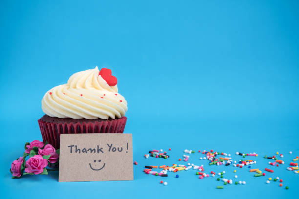 istock Thank you note with cupcake and pink bouquet rose flower 1127061825